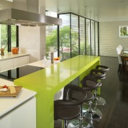 This house was transformed in a two-stage remodel architecture, countertop, interior design, kitchen, real estate, yellow