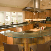 A view of a kitchen designed by Richard countertop, interior design, kitchen, real estate, restaurant, brown, orange