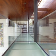 View of the suspended hallway. - View of architecture, ceiling, daylighting, estate, floor, flooring, glass, house, interior design, leisure centre, real estate, wood, gray
