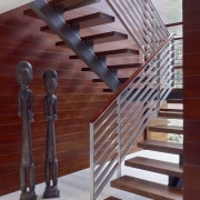 View of the main stairway. - View of handrail, stairs, structure, wood, red, gray