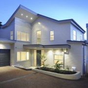 Exterior shot of white house. - Exterior shot architecture, building, elevation, estate, facade, home, house, property, real estate, residential area, siding, window, teal