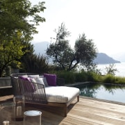 Outdoor day bed. Great for relaxing outside. - backyard, deck, furniture, home, house, outdoor furniture, outdoor structure, patio, property, real estate, resort, sunlounger, table, wood, white