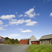 Architect Alexander Gorlin distilled the essence of a barn, cloud, cottage, estate, farm, farmhouse, field, grassland, home, house, land lot, landscape, property, real estate, residential area, rural area, sky, teal