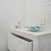 This square-edged custom vanity unit is fabricated from bathroom sink, ceramic, floor, furniture, interior design, product, product design, tile, wall, wallpaper, gray