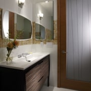 Powder room in a remodeled Miami apartment. The bathroom, bathroom accessory, bathroom cabinet, cabinetry, home, interior design, room, sink, gray