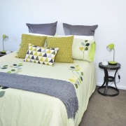 Seen here is a David Reid show home. bed, bed frame, bed sheet, bedding, bedroom, duvet cover, furniture, home, interior design, linens, product, room, textile, yellow, white