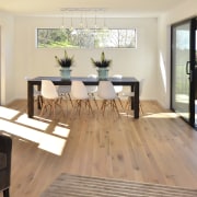 Seen here is a David Reid show home. floor, flooring, hardwood, house, interior design, laminate flooring, living room, real estate, room, table, wood, wood flooring, white