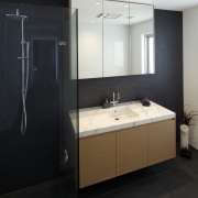 Seen here is the bathroom in the house bathroom, bathroom accessory, bathroom cabinet, interior design, room, sink, black, white