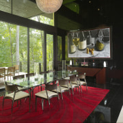 Glossy black tiles wrap the wall and extend architecture, dining room, interior design, restaurant, table, black