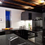 This kitchen, designed by the owner in conjunction ceiling, countertop, interior design, kitchen, black