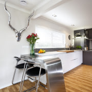 A view of the kitchen area. - A floor, flooring, house, interior design, kitchen, loft, real estate, room, table, white