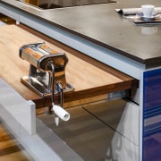 This kitchen was designed by Kim Duffin of countertop, floor, flooring, furniture, hardwood, table, wood, gray