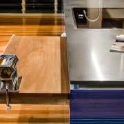 This kitchen was designed by Kim Duffin of countertop, floor, flooring, furniture, hardwood, interior design, kitchen, table, wood, wood flooring, wood stain, orange