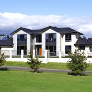 This home won the Registered Master Builders House cottage, elevation, estate, facade, farmhouse, home, house, mansion, property, real estate, residential area, sky, suburb, villa, white, green