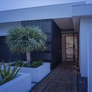 To define the entry to this large home, apartment, architecture, estate, facade, home, house, majorelle blue, property, real estate, sky, window, blue