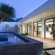 This new house opens up to a large apartment, architecture, condominium, estate, home, house, interior design, penthouse apartment, property, real estate, resort, swimming pool, villa, window, blue