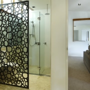 The glossy black acrylic privacy divider in this architecture, interior design, real estate, room, wall