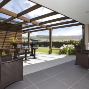 The flooring for this Otago home was chosen daylighting, estate, floor, flooring, house, interior design, lobby, outdoor structure, patio, property, real estate, roof, gray, white