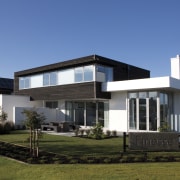 This street is part of a new initiative architecture, building, corporate headquarters, cottage, elevation, estate, facade, home, house, property, real estate, residential area, villa, teal