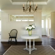 View of the interior entrance to the the ceiling, dining room, floor, flooring, furniture, hardwood, home, interior design, living room, lobby, room, table, wall, window, wood flooring, gray