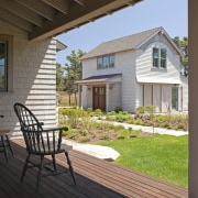 Exterior view of the home from the porch. backyard, cottage, deck, estate, home, house, outdoor structure, porch, property, real estate, residential area, siding, window, yard