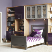 Seen here is a storage system/closet designed and bed, bed frame, bookcase, furniture, product, room, shelf, shelving, wardrobe, gray, white