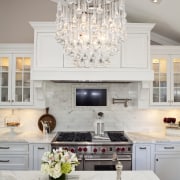 A view of a kitchen designed by Iris ceiling, chandelier, countertop, cuisine classique, dining room, home, interior design, kitchen, light fixture, lighting, living room, room, gray