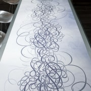 Wallpaper motif on benchtop with cantilevered glass countertop design, drawing, gray, white