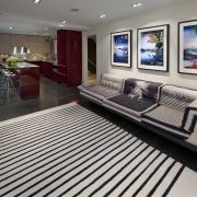 familty room area featuring artworks - familty room floor, flooring, interior design, living room, lobby, gray, black