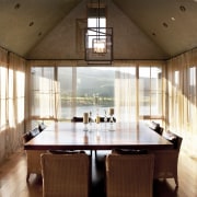 A view of a home designed by Tim architecture, ceiling, dining room, estate, house, interior design, real estate, room, table, window, wood, brown, white