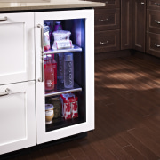 Wine refrigerator from the True Professional Series, a cabinetry, countertop, floor, flooring, hardwood, home appliance, kitchen, kitchen appliance, major appliance, refrigerator, wood flooring, red, white