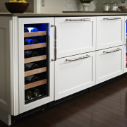 Wine refrigerator from the True Professional Series, a cabinetry, countertop, home appliance, kitchen, kitchen appliance, major appliance, refrigerator, room, white, black