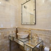 A highly reflective antique mirrored console acts as bathroom, floor, flooring, home, interior design, room, sink, tile, wall, orange, brown