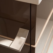 cabinetry in this remodeled bathroom  is done angle, chest of drawers, drawer, furniture, product design, shelf, sideboard, table, brown, white