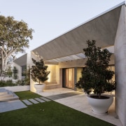 A new sandstone-clad form frames the entry to architecture, building, estate, facade, home, house, property, real estate, residential area, villa, gray, brown
