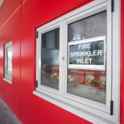 Protech Designs fire protection for Silverdale Centre window, red