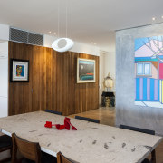 Feature interior surfaces in this renovated beachfront home apartment, ceiling, interior design, real estate, room, table, wall, gray