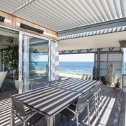 Operable louvres on the balconies of this beachfront apartment, condominium, estate, home, penthouse apartment, property, real estate, villa, gray