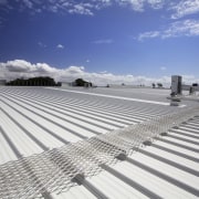 The Silverdale Centre roof was installed by Kiwi architecture, cloud, daylighting, line, outdoor structure, roof, sky, structure, gray, blue, white