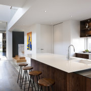 This kitchen in a contemporary home features a architecture, countertop, interior design, kitchen, real estate, gray