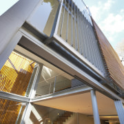 A glazed, three-storey atrium fills this home with architecture, building, daylighting, facade, house, roof, structure, white, gray