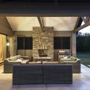 This contemporary, well-balanced masonry home was designed and estate, home, house, interior design, lighting, living room, outdoor structure, patio, property, real estate, black