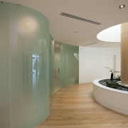 Frameless curved glass walls and doors are a architecture, ceiling, floor, flooring, glass, interior design, real estate, brown