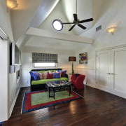 This guest suite in a remodeled Malibu beach ceiling, floor, hardwood, home, house, interior design, living room, property, real estate, room, wood flooring, gray