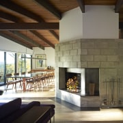 The original ceramic tile fireplace surround in this fireplace, hearth, interior design, living room, wood burning stove, brown