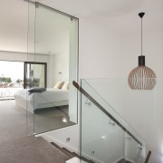 Glass balustrading and floor-to-ceiling glazed doors give a architecture, ceiling, daylighting, floor, glass, handrail, home, house, interior design, product design, table, gray