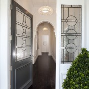 Traditional leadlighting was retained in this villa restoration, door, estate, home, house, interior design, real estate, window, white, gray