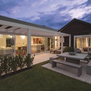 The Life at Home street of show homes backyard, cottage, elevation, estate, facade, home, house, lighting, property, real estate, residential area, siding, villa, window, black