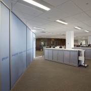 Storage cabinets and workstations in the GHD office. ceiling, daylighting, interior design, office, real estate, gray