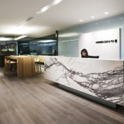 In keeping with an emphasis on natural materials, ceiling, floor, flooring, interior design, lobby, wood flooring, gray